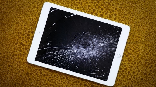 Cracked iPad screen repair. The iPad screen is shattered in a spiderweb pattern. ER4Gadgets