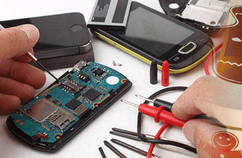 iPhone repair close-up: Hands fixing a phone's internal components in Houston. ER4Gadgets